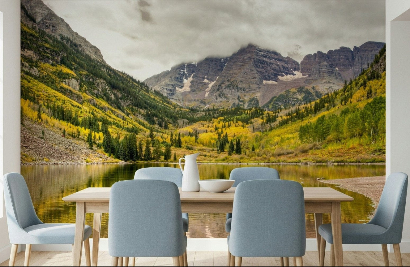 Mountain lake wall mural with deep blue water and golden larch trees.