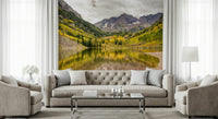 Majestic peak wall mural with a foreground of bright orange autumn leaves.