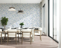 Soft azure floral wall covering for a contemporary dining area with natural light.