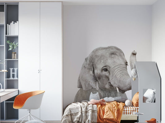 Cute baby elephant trunk raised

