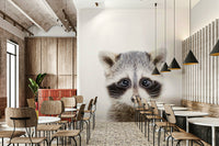 Cute baby raccoon wall mural in a woodland nursery

