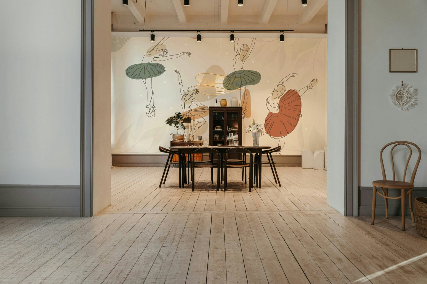 The image features several stylized ballerinas in various dance poses.
