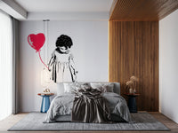 Balloon Girl Art Wall Mural behind a sleek sofa in a contemporary room.
