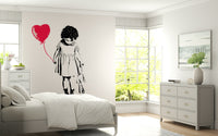 Neutral toned Balloon Girl Art wallpaper in a bright and airy gallery lounge.