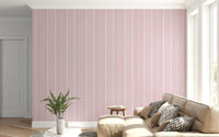 Bright living room featuring soft vertical stripe wallpaper in blush tones