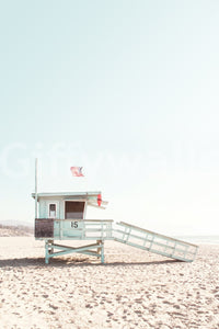 Blue skies, golden sand, and calm waves.