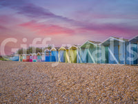 A detail of the warm tones in the beach huts and sky.

