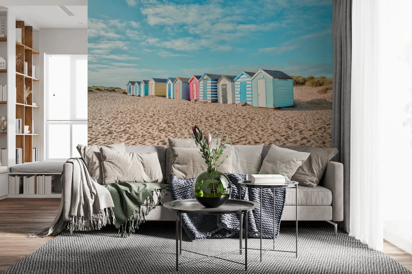 Beach Huts on the Shore Wall Mural behind a modern living room with layered seating, GD8871