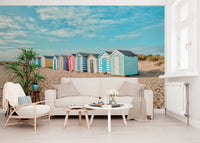 A sunlit Living corner framed by Beach Huts on the Shore Wall Mural and soft dunes, GD8871