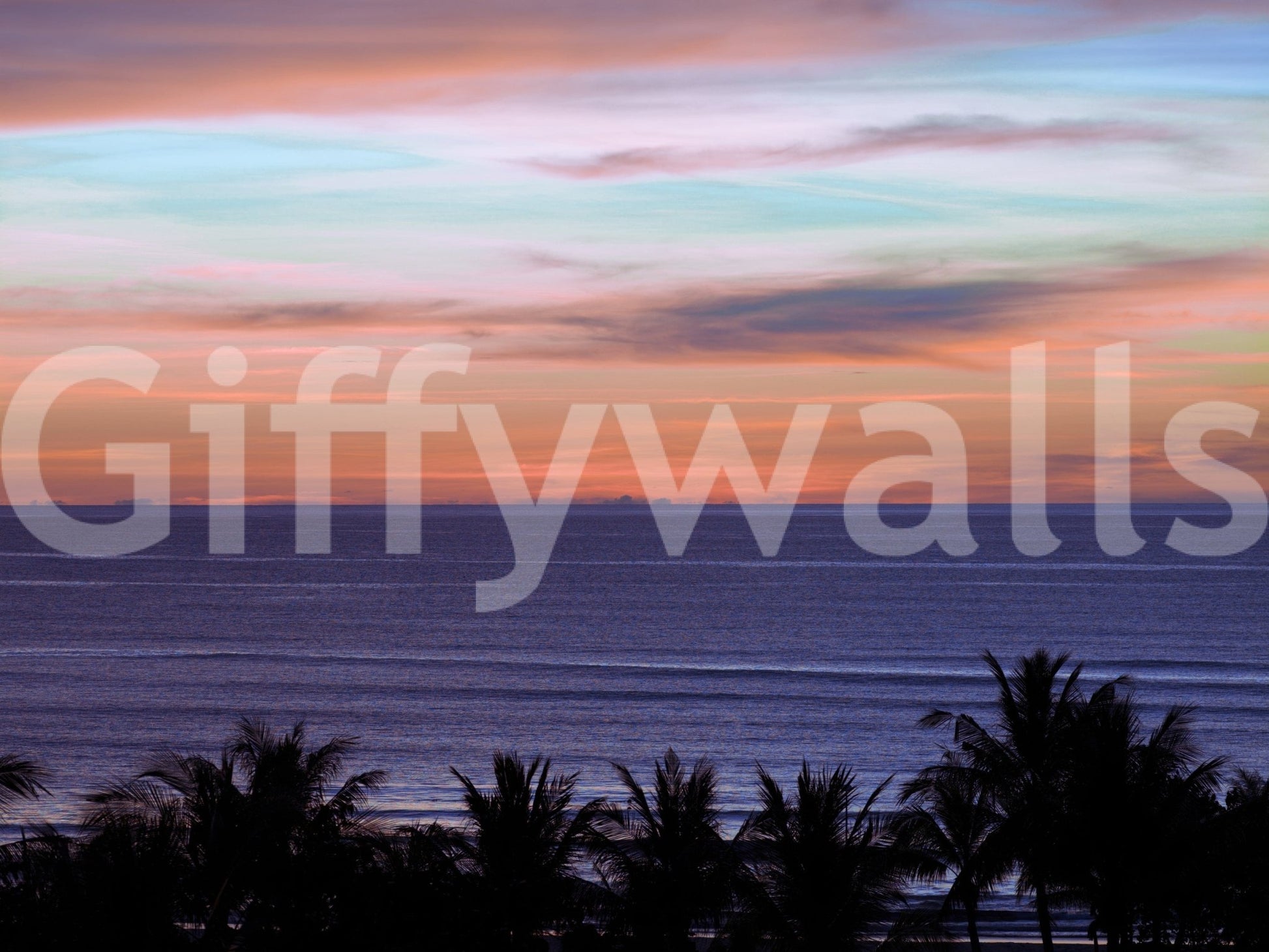 Beach Sunset Wall Mural in a dining area with rattan furniture wallpaper.