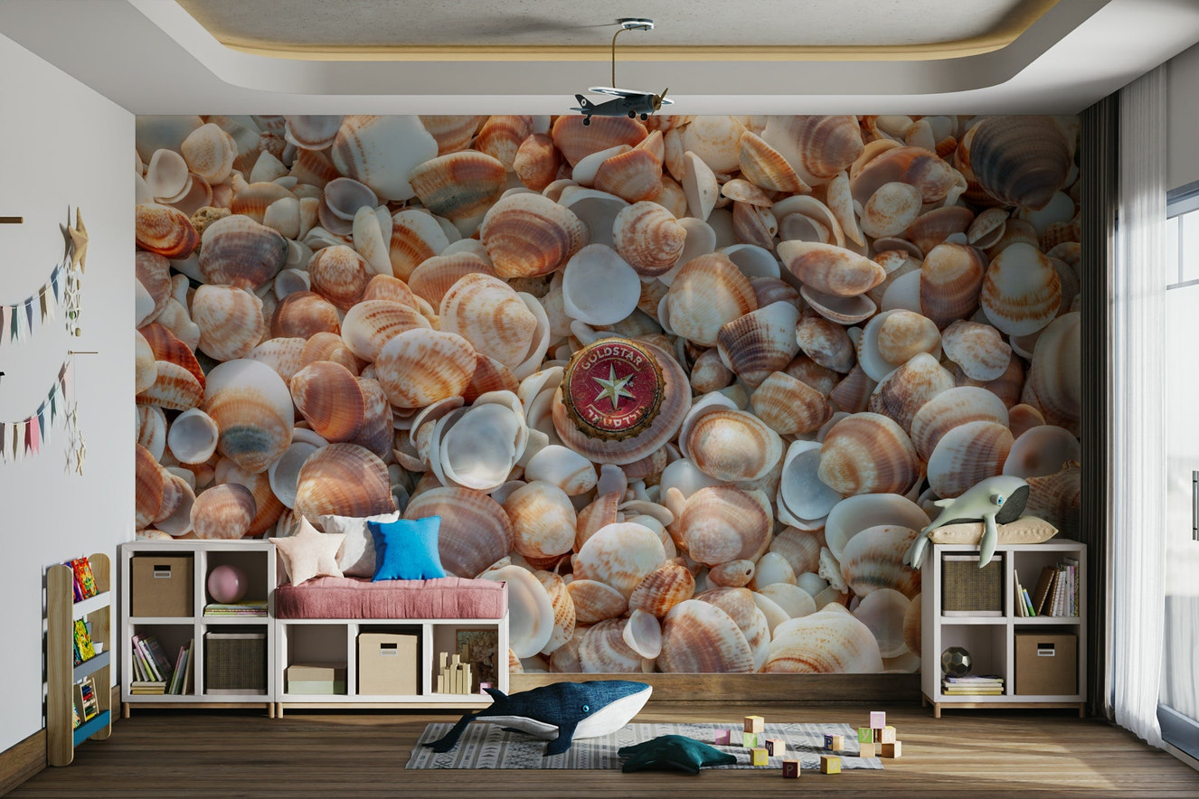 Beach treasures mural with seashells and driftwood.

