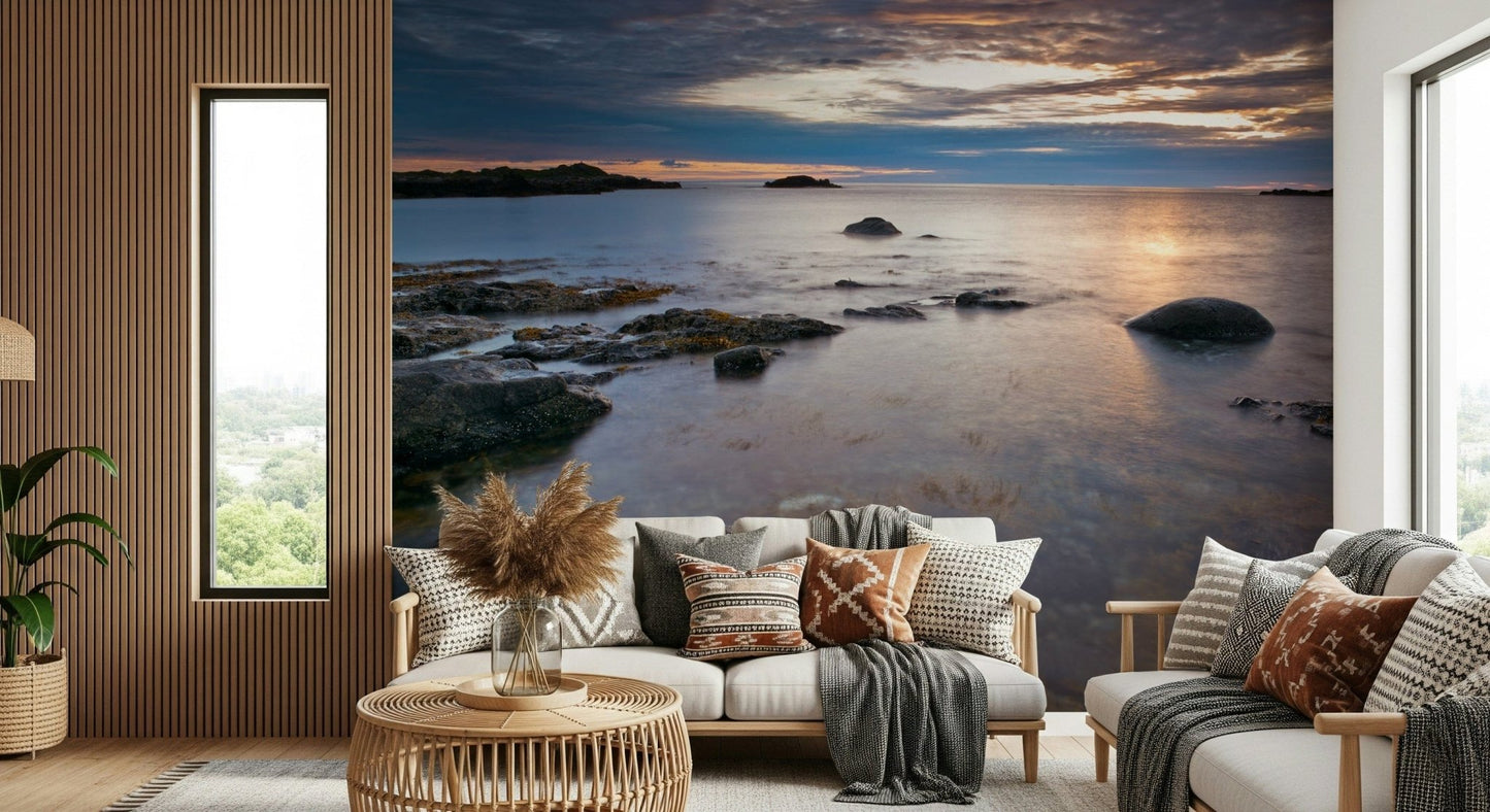 Dusk ocean view mural behind a grey contemporary sofa