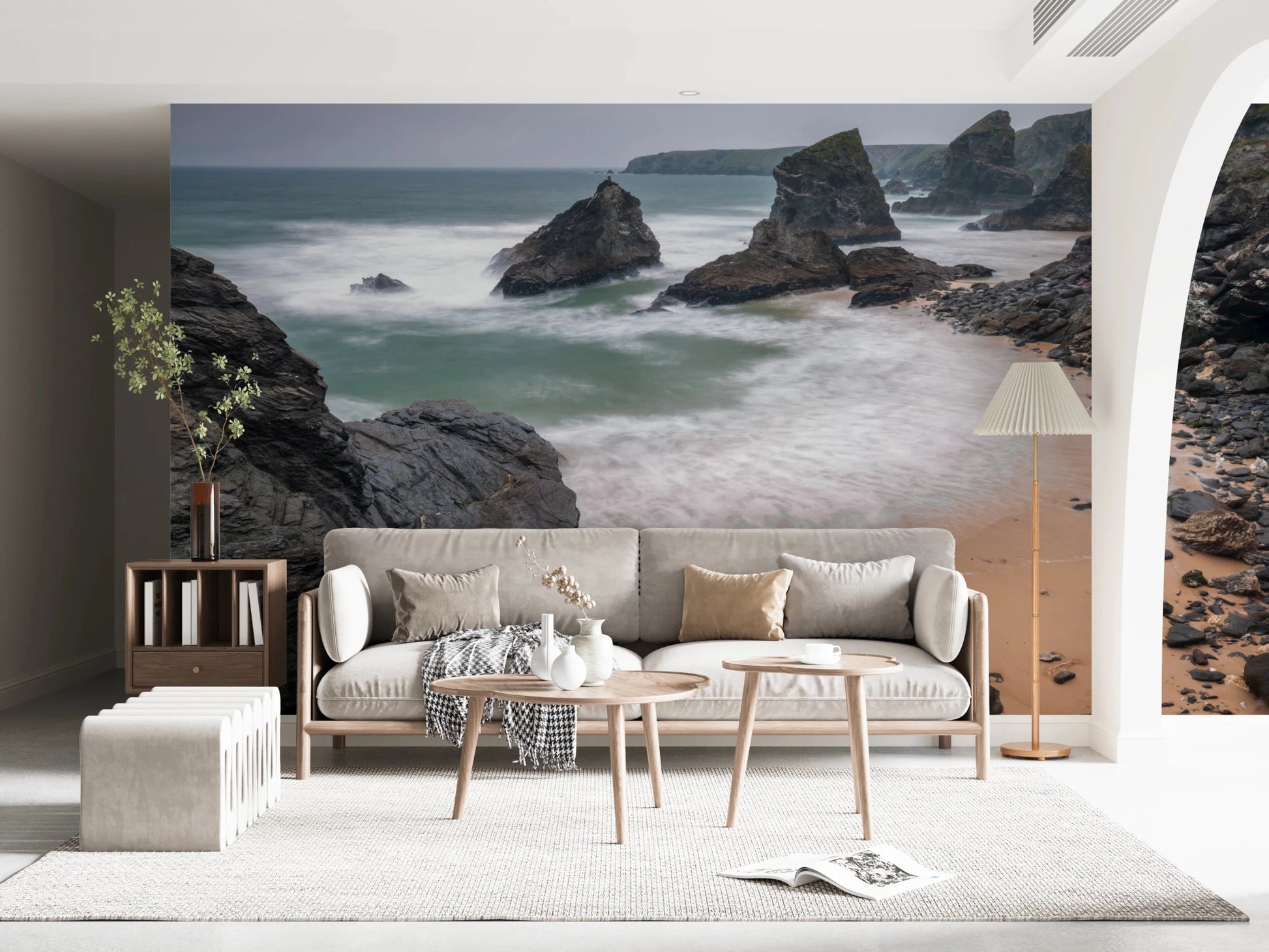 Compact reading corner gains depth from coastal cliff mural and gentle waves, GD8237