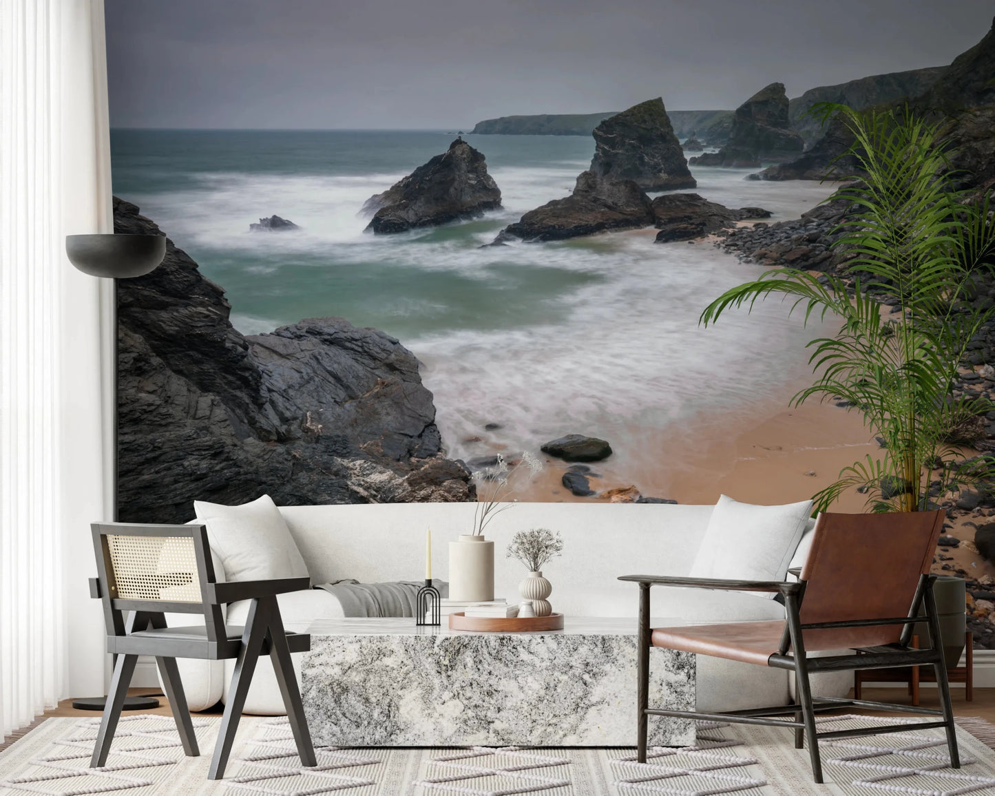 Dining area styled with natural beach mural showing rocks and sea movement, GD8237