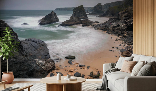 Coastal rock shoreline mural brings soft ocean movement into this neutral living room