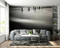 An artistic seaside view mural on minimalist wallpaper.

