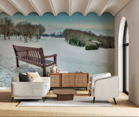 Serene winter forest and snow covered hill wallpaper design.