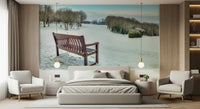 Wooden bench overlooking a snowy landscape wallpaper mural.