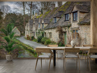 The roofs of the cottages are covered in green moss.

