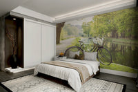 Bicycle leaning beside a peaceful waterway mural

