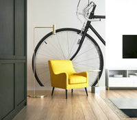 Urban cycling mural with graffiti-style background on loft wall

