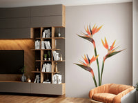 Lush greenery and exotic flowers in wall mural design

