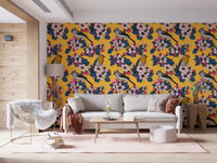 Yellow botanical wallpaper with blooming branches and multicolor birds