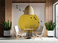 Detailed sun and bird wallpaper in a contemporary lounge.