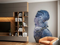 Bold black bird mural in lush green surroundings


