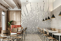 Minimalist black sun rays mural with golden accents

