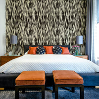 Dramatic black waves mural.
