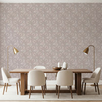 Dining room setup with Bloomscape Beige Wallpaper behind a wooden table and chairs