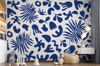 White and cobalt wall mural with clipped garden motifs and artistic movement
