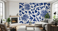 Living room styled with Blue Clipped Garden wall mural and cobalt leaf forms
