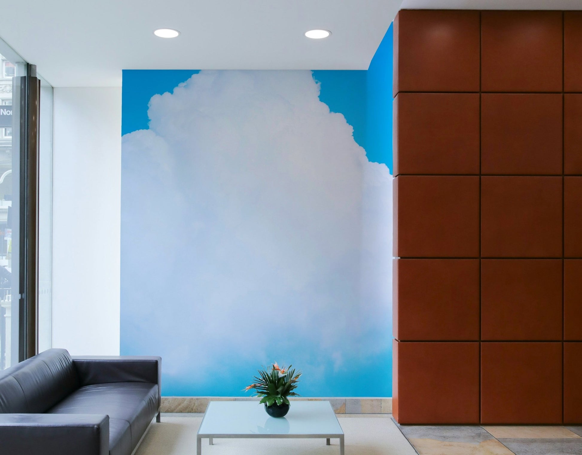 Sunny blue sits at the corners of a tall cloud in this Blue Clouds III wall mural GD4845
