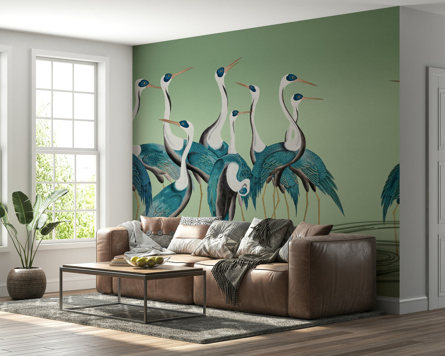 Contemporary lounge area showing Crane Chorus wallpaper behind a grey armchair.