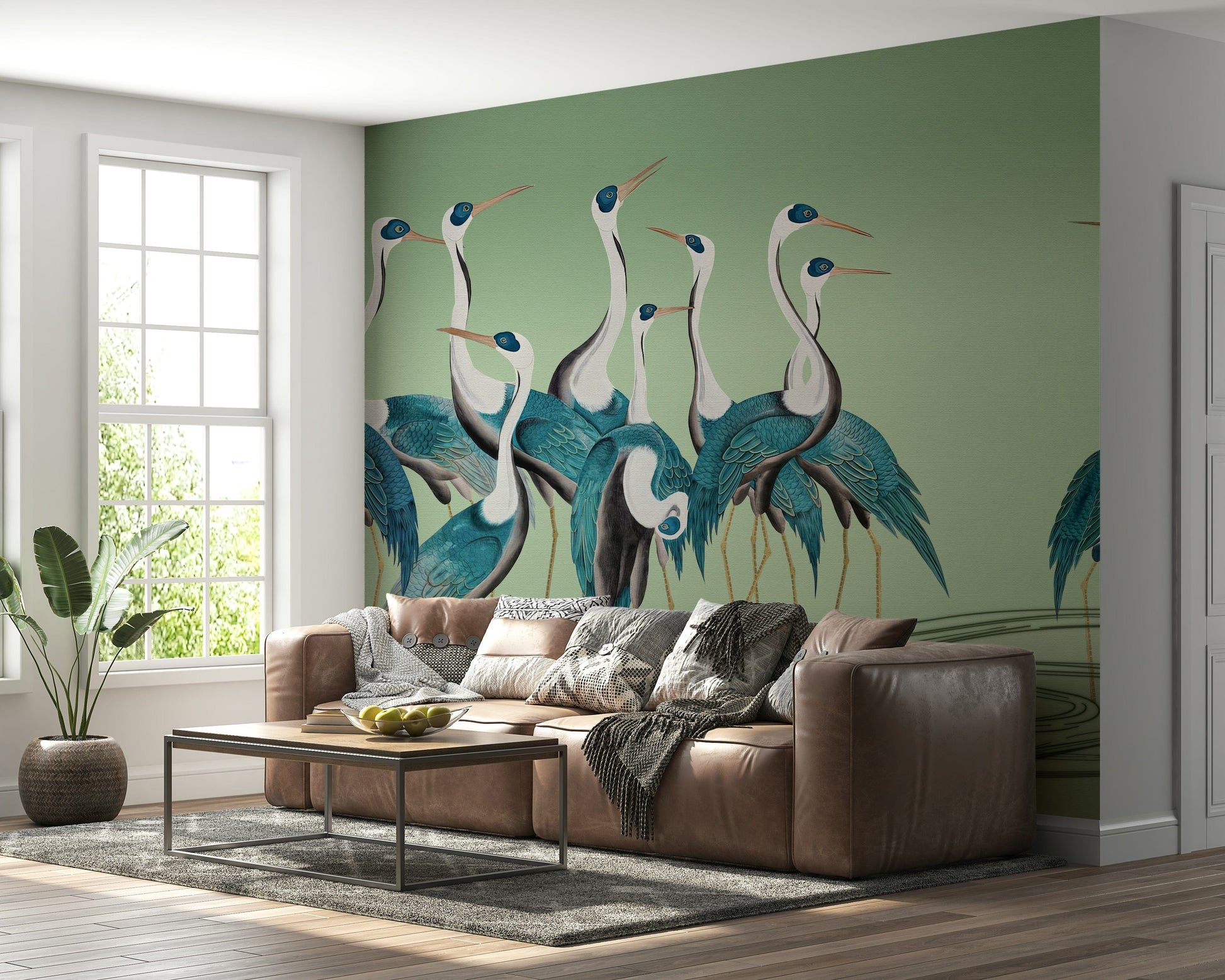 Contemporary lounge area showing Crane Chorus wallpaper behind a grey armchair.