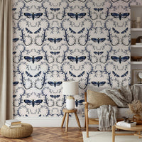 Deep blue wallpaper with gothic moths and winding vines.

