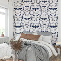 Elegant dark wallpaper featuring moths in a blue forest tangle.

