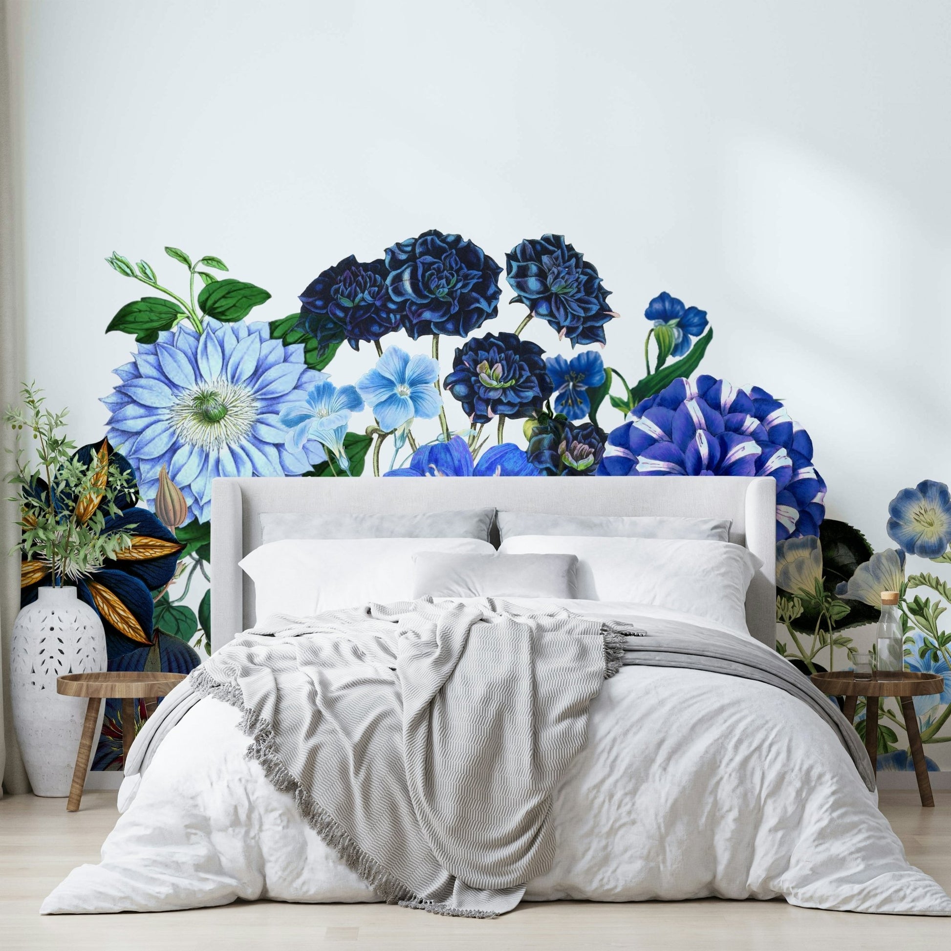 A peaceful wall mural with a field of blue flowers.

