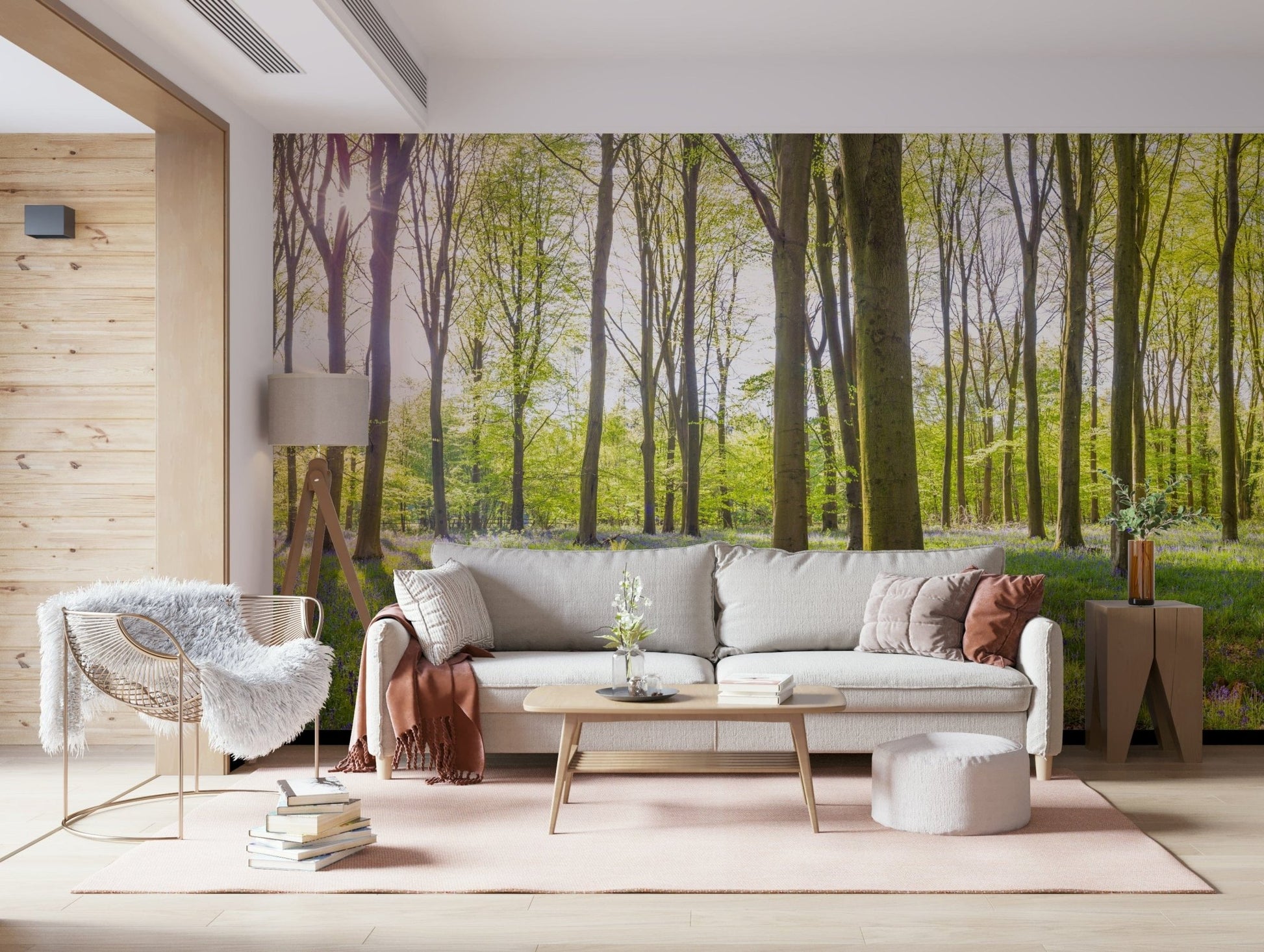 Bluebell Woods Wall Mural behind a comfortable seating area.