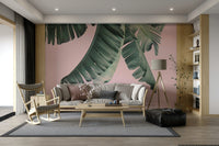 Blush and banana wall mural with tropical leaves

