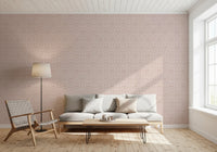 Soft rose tones in a damask wallpaper for nursery decor