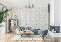 Blush Meadow's Whisper Wallpaper in a bright living room with wooden furniture.