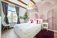 Neutral blush pink arches wallpaper in kids' playroom

