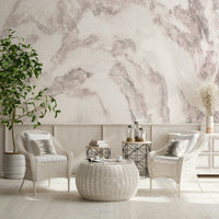Blush stone wallpaper mural behind a modern sofa.