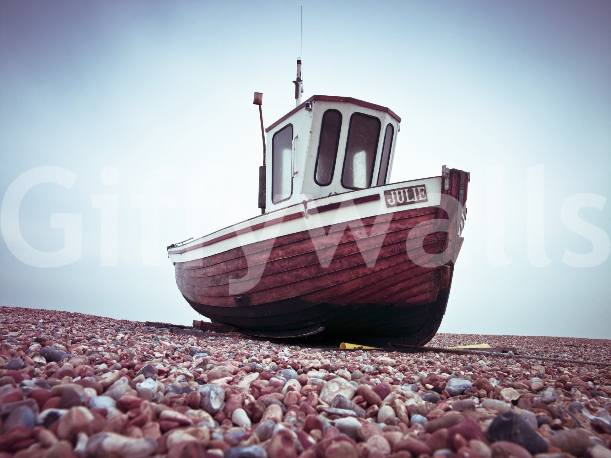 Wooden fishing boat Boat Resting on Pebbled Strand artistic wall covering.
