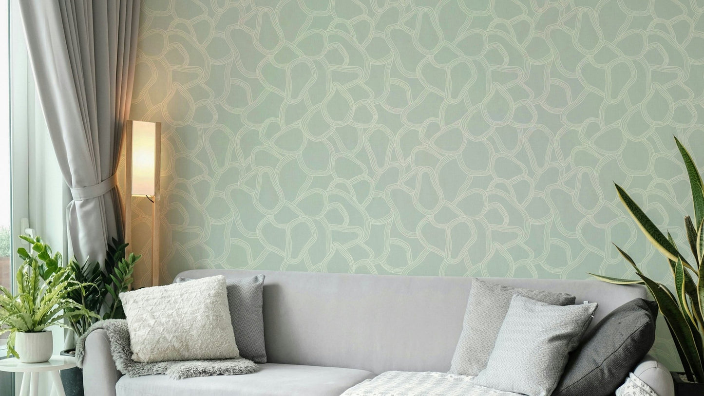 Soft green wallpaper with irregular arch design

