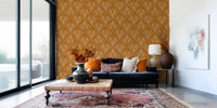 Minimal seating area styled with mustard gold floral wallpaper and clean design