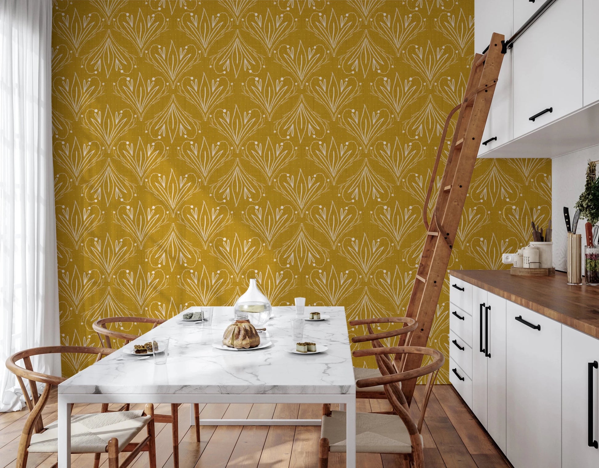 Dining space featuring mustard gold botanical wallpaper with modern table setup